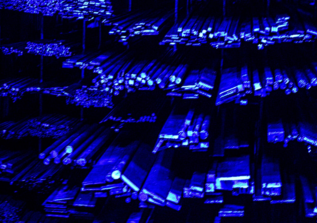 rows of metal bars illuminated with blue light data center