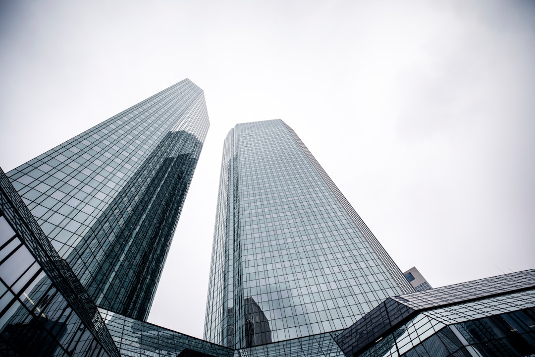 a couple of tall buildings sitting next to each other
