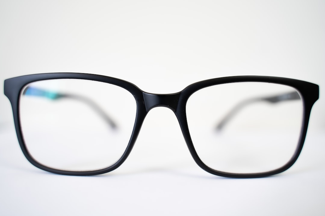 a pair of glasses sitting on top of a table