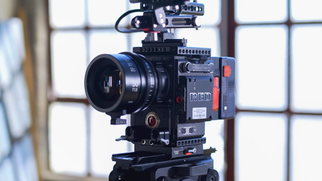 close-up of black camera with tripod in production studio