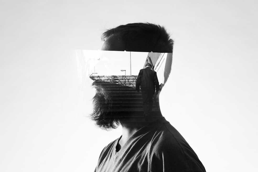 man walking up the stairs projection on man's head illustration