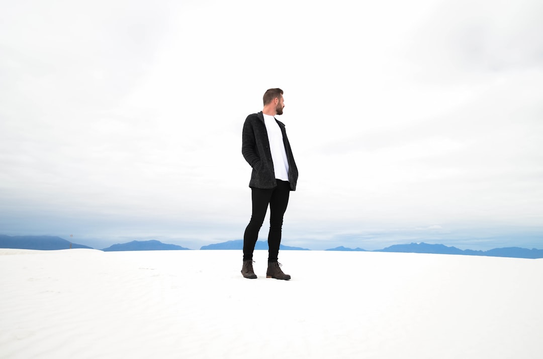 man standing on snowfield fashion style