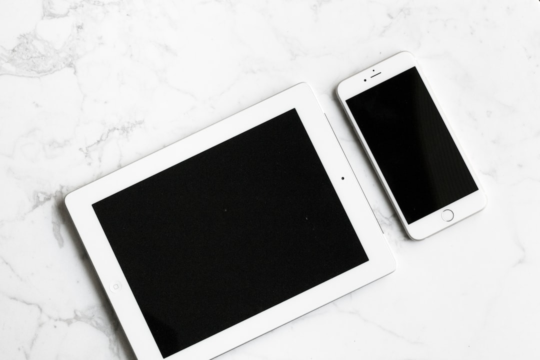 white iPad and silver iPhone representing multiple devices