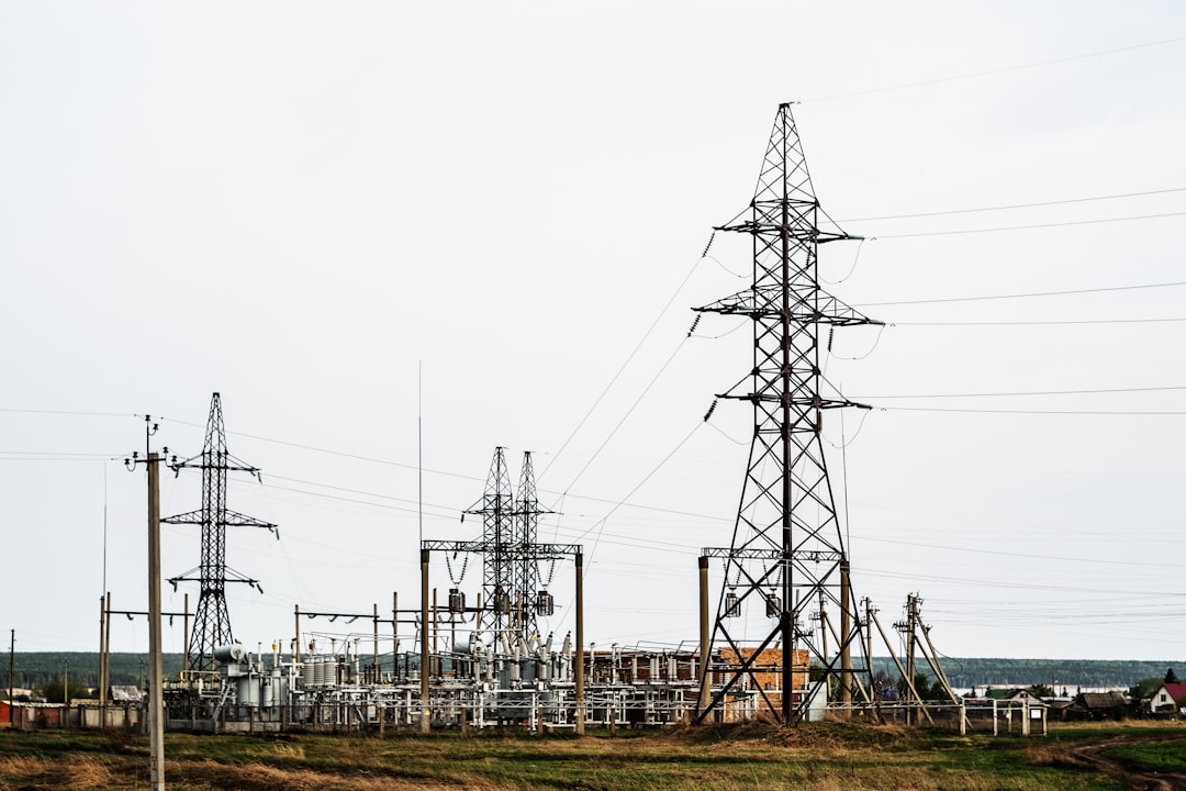 black electric towers representing power grid infrastructure