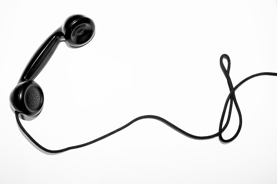 black corded telephone, symbolizing a phone call