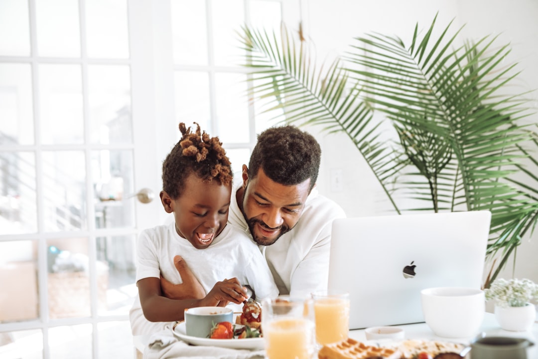 family using laptop together at home