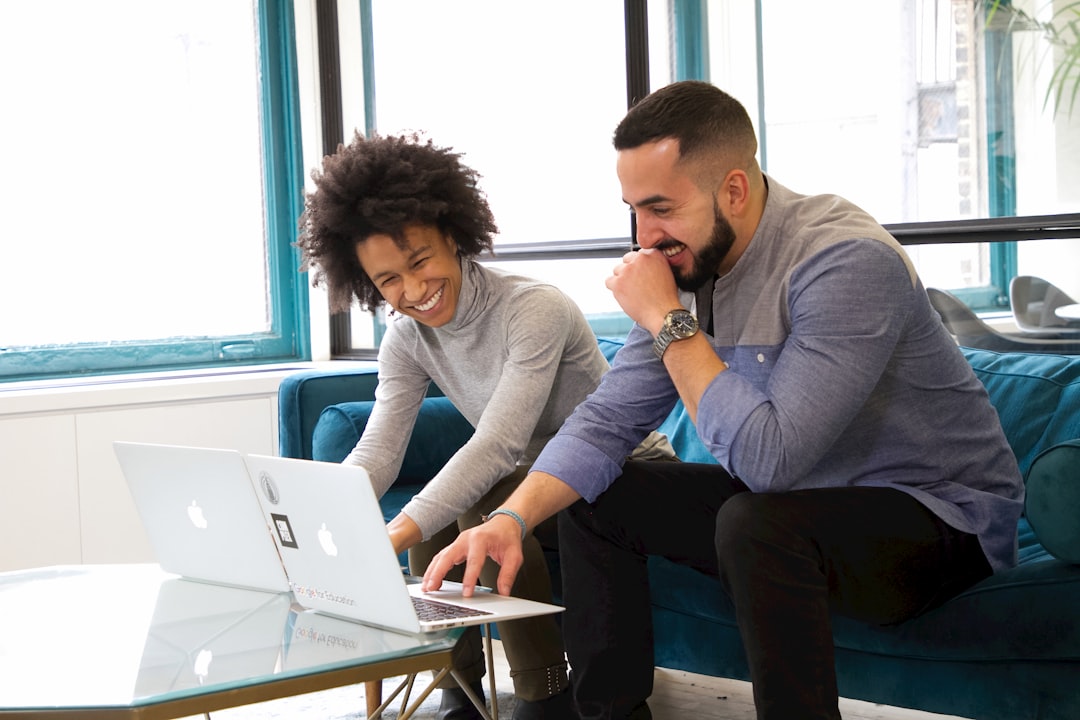 team collaborating on laptop in office