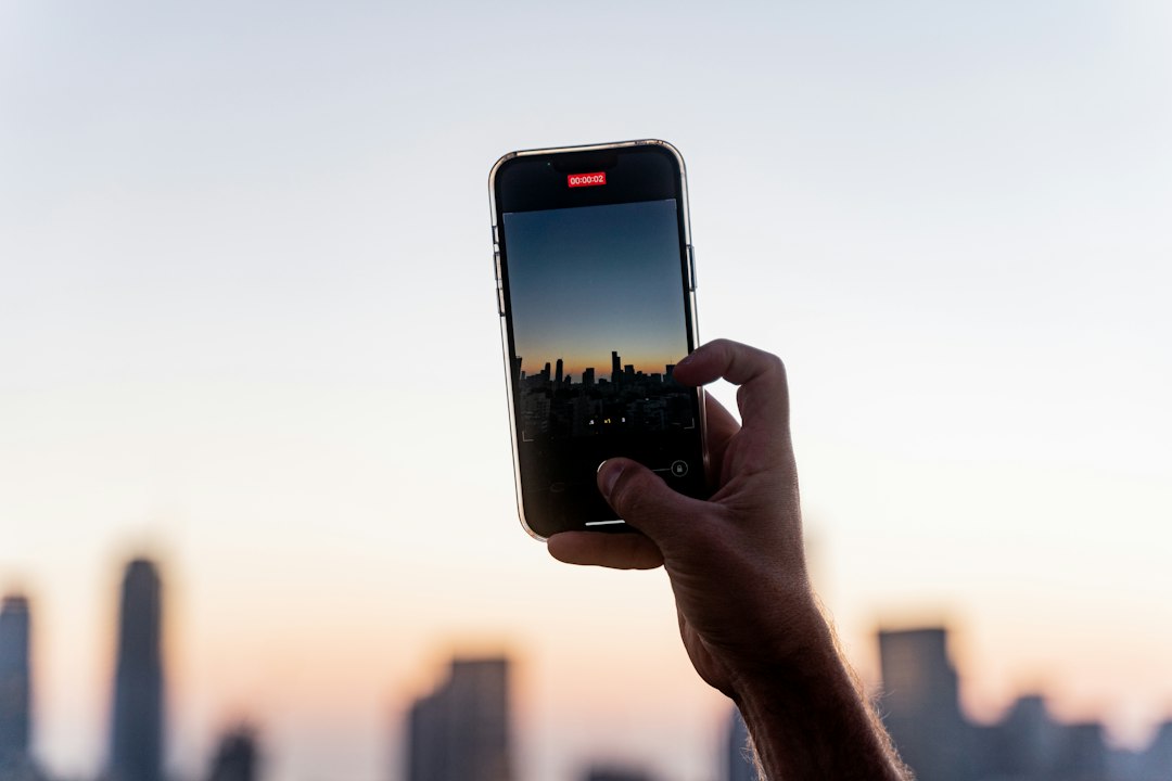 a hand holding a phone
