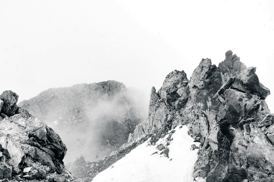 a black and white photo of a mountain range