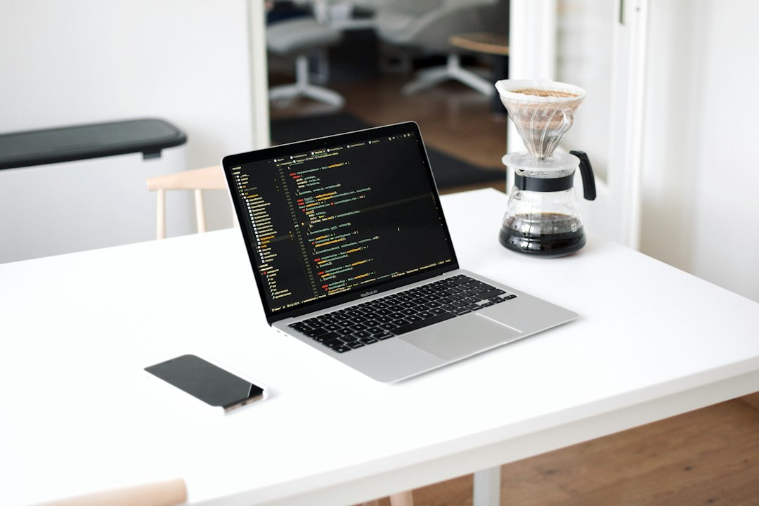 laptop on white table